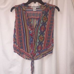 Colorful 60’s inspired tie front sleeveless top
